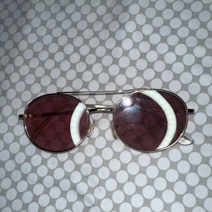 Gold embroider with oval shaped frames and pink tint sunglasses